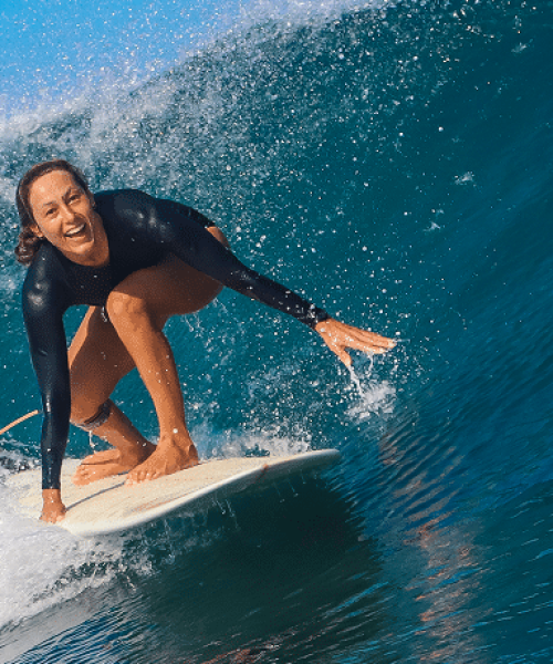 female-surfer-on-a-blue-wave-2025-01-08-22-31-20-utc 1(1)